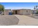 Cozy home featuring a well-maintained exterior and a private driveway at 1707 S 72Nd St, Mesa, AZ 85209