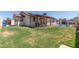 Nice grassy backyard with a refreshing in-ground pool and partially covered patio space at 2003 W Tyson St, Chandler, AZ 85224