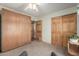 Bedroom featuring carpet, doors, ceiling fan, and murphy bed at 2003 W Tyson St, Chandler, AZ 85224