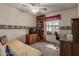 Carpeted bedroom with ceiling fan, desk, bed, and bookshelf at 2003 W Tyson St, Chandler, AZ 85224