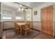 Comfortable dining room with wood table and chairs, ceiling fan and carpeted floor at 2003 W Tyson St, Chandler, AZ 85224