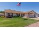 Single-Gathering home with a lush lawn, complemented by neatly trimmed bushes and an attached two-car garage at 2003 W Tyson St, Chandler, AZ 85224