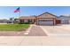 Charming single-Gathering home featuring a well-manicured lawn and an attached two-car garage at 2003 W Tyson St, Chandler, AZ 85224