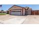 Home featuring a garage and paved driveway, offering ample parking and curb appeal at 2003 W Tyson St, Chandler, AZ 85224