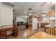Open kitchen and living area featuring wood cabinets, linoleum floors and a desk at 2003 W Tyson St, Chandler, AZ 85224