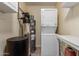 Laundry room with a stacked washer and dryer, plus the water heater at 2003 W Tyson St, Chandler, AZ 85224