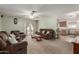 Spacious living room with comfortable brown leather furniture, ceiling fan and back yard access at 2003 W Tyson St, Chandler, AZ 85224