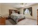 Cozy carpeted bedroom featuring a ceiling fan and lots of natural light at 2003 W Tyson St, Chandler, AZ 85224