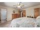 Bedroom featuring carpet, doors, and a view of the bathroom and closet at 2003 W Tyson St, Chandler, AZ 85224