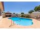 Backyard swimming pool with a gazebo, seating and privacy fence at 2003 W Tyson St, Chandler, AZ 85224
