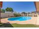 Backyard pool area, surrounded by a concrete deck and privacy walls at 2003 W Tyson St, Chandler, AZ 85224