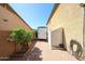 Spacious backyard area featuring brick pavers, a storage shed, a trailer, and mature trees at 22022 W Moonlight Path, Buckeye, AZ 85326