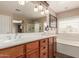 Bathroom features a double vanity, soaking tub, and separate glass enclosed shower at 22022 W Moonlight Path, Buckeye, AZ 85326