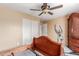 Bedroom with carpet, closet, and view into ensuite bathroom at 22022 W Moonlight Path, Buckeye, AZ 85326