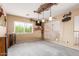 Spacious bonus room with unique light fixtures and ample natural light at 22022 W Moonlight Path, Buckeye, AZ 85326