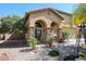 Beautiful two-story home with a charming front porch and desert-friendly landscaping at 22022 W Moonlight Path, Buckeye, AZ 85326