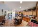 Open kitchen showing wood cabinets, a granite island with seating, and modern appliances at 22022 W Moonlight Path, Buckeye, AZ 85326