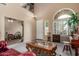 Inviting living room featuring vaulted ceiling, an arched window, and a comfortable seating arrangement at 22022 W Moonlight Path, Buckeye, AZ 85326