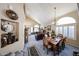 Open-concept living and dining area with ample natural light and stylish decor at 22022 W Moonlight Path, Buckeye, AZ 85326