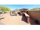 Outdoor kitchen area with stone counter, built-in grill, and comfortable seating surrounding the kitchen at 22022 W Moonlight Path, Buckeye, AZ 85326