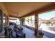 Spacious covered patio with comfortable seating, decorative accents, and a backyard view at 22022 W Moonlight Path, Buckeye, AZ 85326