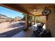 Covered patio featuring comfortable seating with backyard view with hardscape and decorative plants at 22022 W Moonlight Path, Buckeye, AZ 85326