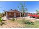 Home featuring a covered patio and a large backyard with a truck at 2207 N 53Rd Ave, Phoenix, AZ 85035