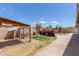 View of the backyard featuring a red truck, concrete patio, and privacy fence at 2207 N 53Rd Ave, Phoenix, AZ 85035