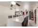 Kitchen featuring a large quartz island with bar seating, stainless steel appliances, and grey cabinetry at 2207 N 53Rd Ave, Phoenix, AZ 85035