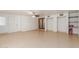 Spacious living room features tile flooring, ceiling fan, and closet storage at 2207 N 53Rd Ave, Phoenix, AZ 85035