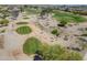 A view of the verdant golf course, enhanced by mature trees and desert landscaping at 2592 E San Rafael Trl, Casa Grande, AZ 85194