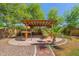 Outdoor area featuring covered patio, dining, and desert landscaping at 2592 E San Rafael Trl, Casa Grande, AZ 85194