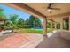 Covered patio leads to well manicured backyard and refreshing pool at 2592 E San Rafael Trl, Casa Grande, AZ 85194