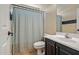 Cozy bathroom featuring a shower with curtain and single sink vanity at 2592 E San Rafael Trl, Casa Grande, AZ 85194