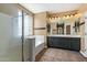 En Suite bathroom featuring dual sinks, soaking tub and shower at 2592 E San Rafael Trl, Casa Grande, AZ 85194