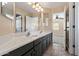 Bathroom featuring double vanity sinks, mirrors and tile flooring at 2592 E San Rafael Trl, Casa Grande, AZ 85194