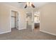 Spacious bedroom with a ceiling fan, closet, and an ensuite bathroom at 2592 E San Rafael Trl, Casa Grande, AZ 85194