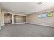 Lofted bonus room featuring bright windows and new neutral carpet at 2592 E San Rafael Trl, Casa Grande, AZ 85194