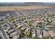 Aerial view of a residential community featuring well-maintained homes, landscaped streets, and mountain views at 2592 E San Rafael Trl, Casa Grande, AZ 85194