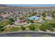 Aerial view of a community pool area with water slides, splash pads, and shaded seating for residents' enjoyment at 2592 E San Rafael Trl, Casa Grande, AZ 85194
