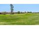 Scenic view of a well-manicured golf course surrounded by lovely homes in a vibrant community at 2592 E San Rafael Trl, Casa Grande, AZ 85194