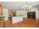 Open kitchen and living room with hardwood floors, stainless steel appliances and center island at 2592 E San Rafael Trl, Casa Grande, AZ 85194