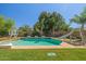 Backyard swimming pool with basketball hoop and water slide feature at 2592 E San Rafael Trl, Casa Grande, AZ 85194