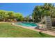 Backyard pool featuring custom water features and slide at 2592 E San Rafael Trl, Casa Grande, AZ 85194