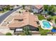 Beautiful property showcasing a pool, well-manicured lawn, and an outdoor patio space at 3060 E Hope St, Mesa, AZ 85213