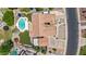 Expansive aerial view of home featuring pool, spa, patio, backyard, and spacious driveway at 3060 E Hope St, Mesa, AZ 85213