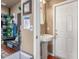 Bathroom featuring a pedestal sink, neutral paint, and white trim, offering a simple and clean design at 3060 E Hope St, Mesa, AZ 85213