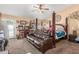 Bedroom includes a four-poster bed, a lounge sofa, and large windows for a bright, airy feel at 3060 E Hope St, Mesa, AZ 85213
