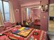 A bedroom showcasing hardwood floors, a closet, and comfortable furnishings at 3060 E Hope St, Mesa, AZ 85213