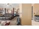 Partially shown, a furnished bedroom with a four-poster bed and a comfortable seating area at 3060 E Hope St, Mesa, AZ 85213